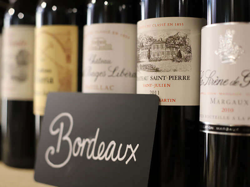 Bottles of fine Bordeaux on a shelf