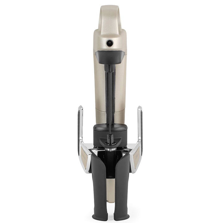 A CORAVIN™ Model Two Elite Plus Pack, featuring a sleek silver design with black handles and a centrally positioned cutting mechanism, is showcased upright against a white background.