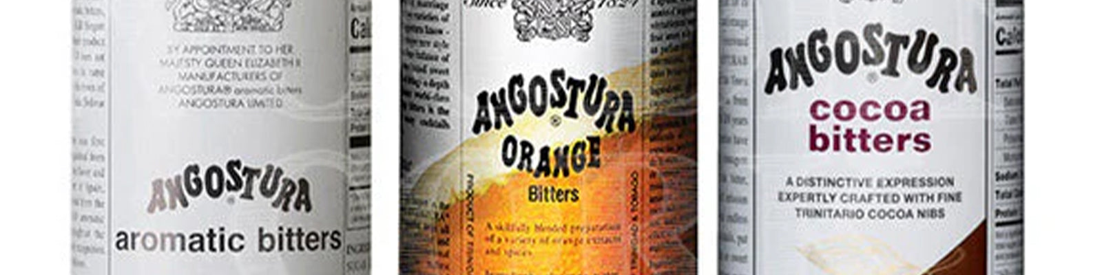 Three Angostura bitters bottles: aromatic on the left, orange bitters in the center with an orange background, and cocoa bitters on the right with a brown cocoa illustration.