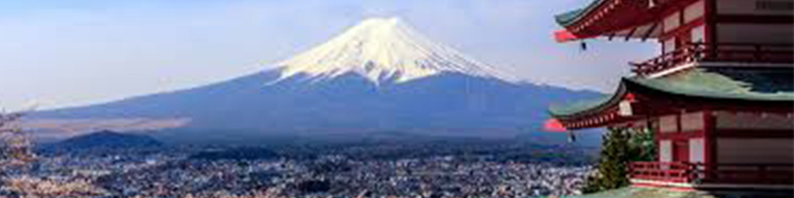 A scenic view of Mount Fuji with a snow-capped peak, accompanied by a traditional Japanese pagoda on the right. Below, a sprawling cityscape stretches across the image.