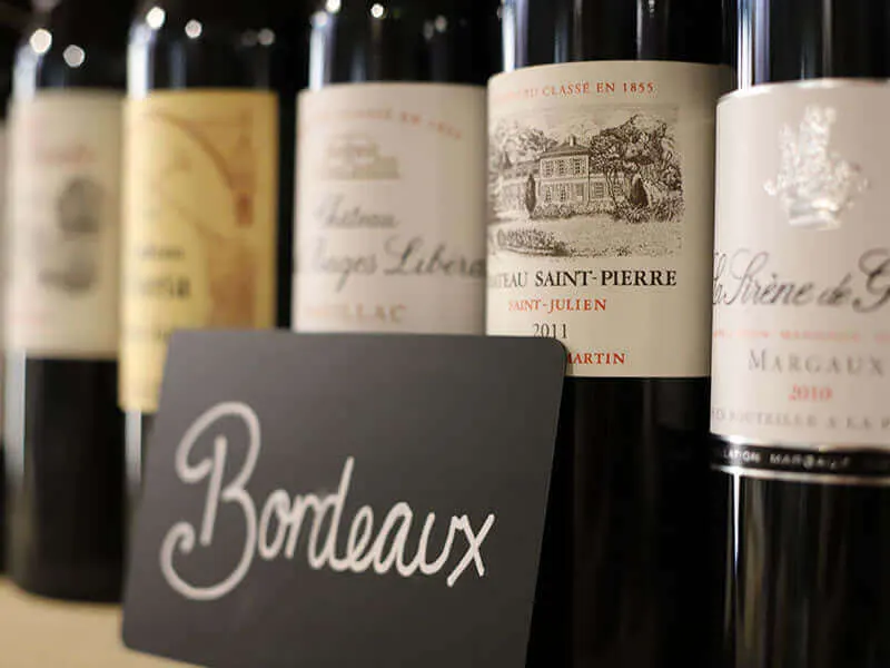 Bottles of fine Bordeaux on a shelf