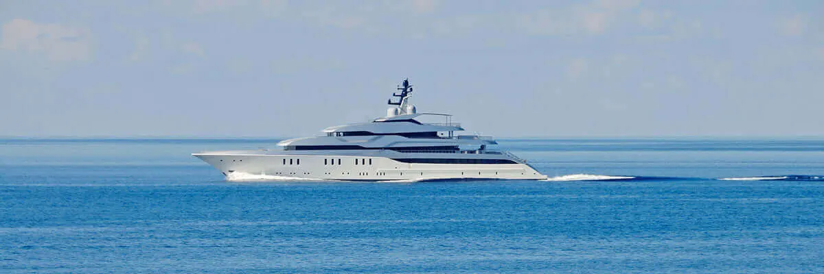 A superyacht under way on calm Mediterranean water